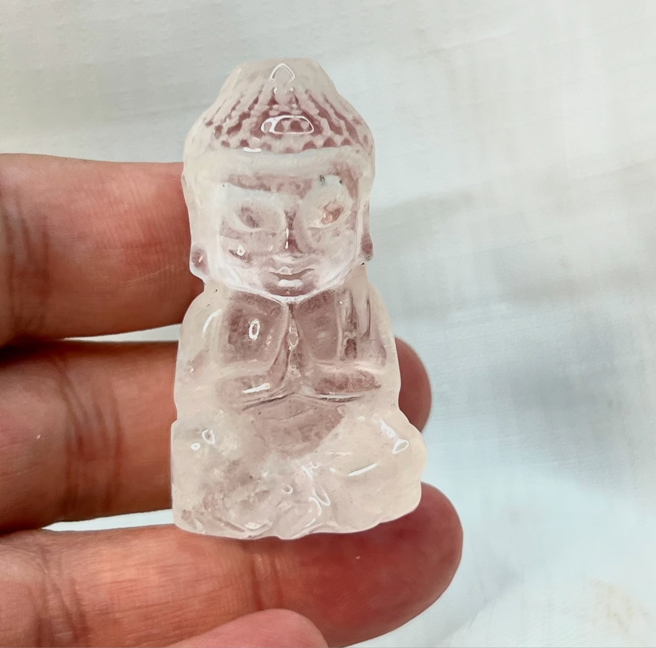 Medium sized Clear Quartz Buddha carving