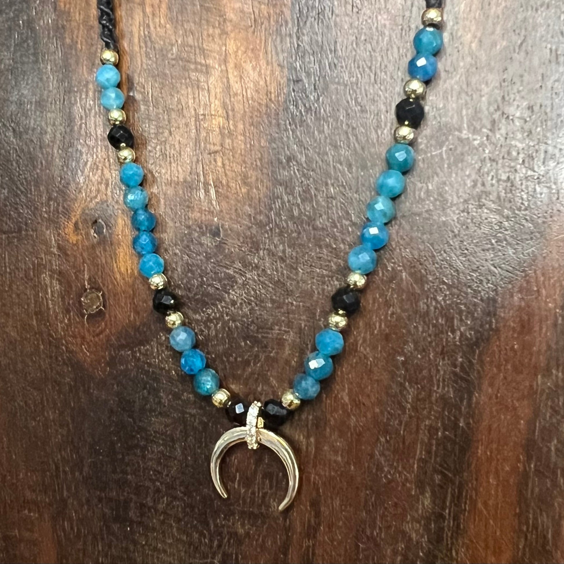 Handmade adjustable macrame necklace with gold horn of plenty pendant, Blue apatite and spinel beads