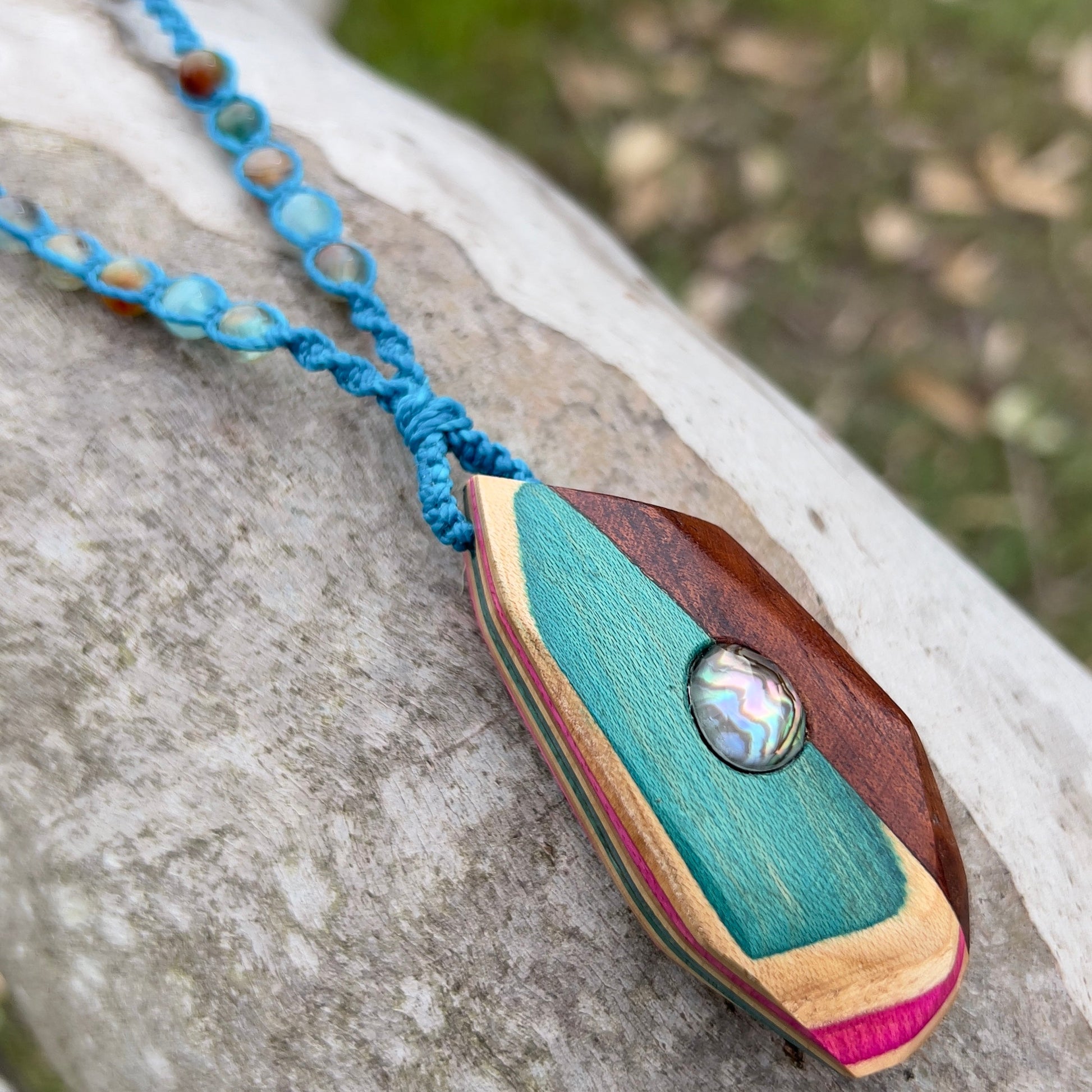 Handmade, unique recycled skateboard pendant with embedded Paua Shell & Quartz Doublet on an adjustable macrame necklace cord woven with Chalcedony beading