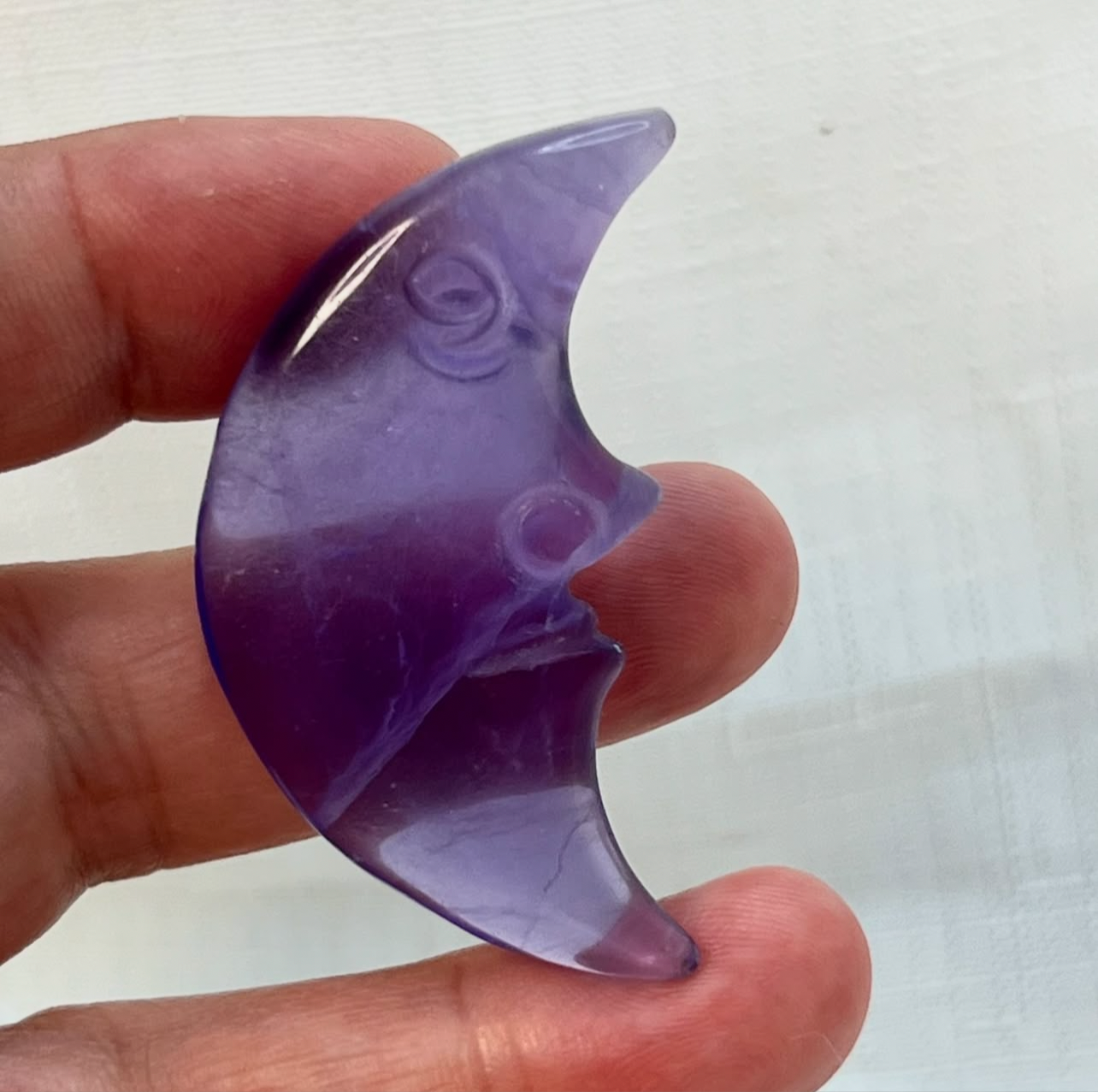 Purple fluorite moon face carved crystal