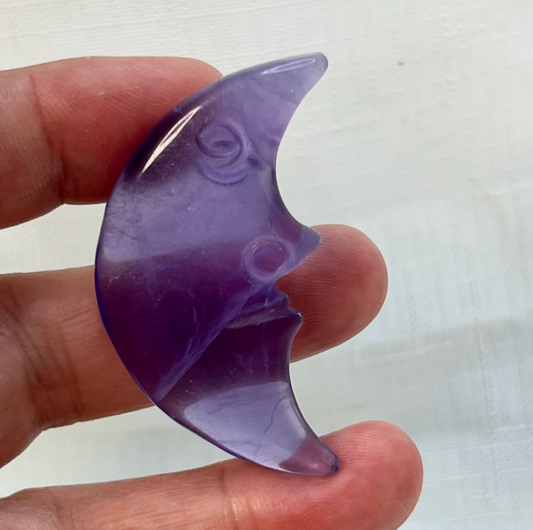 Purple fluorite moon face carved crystal