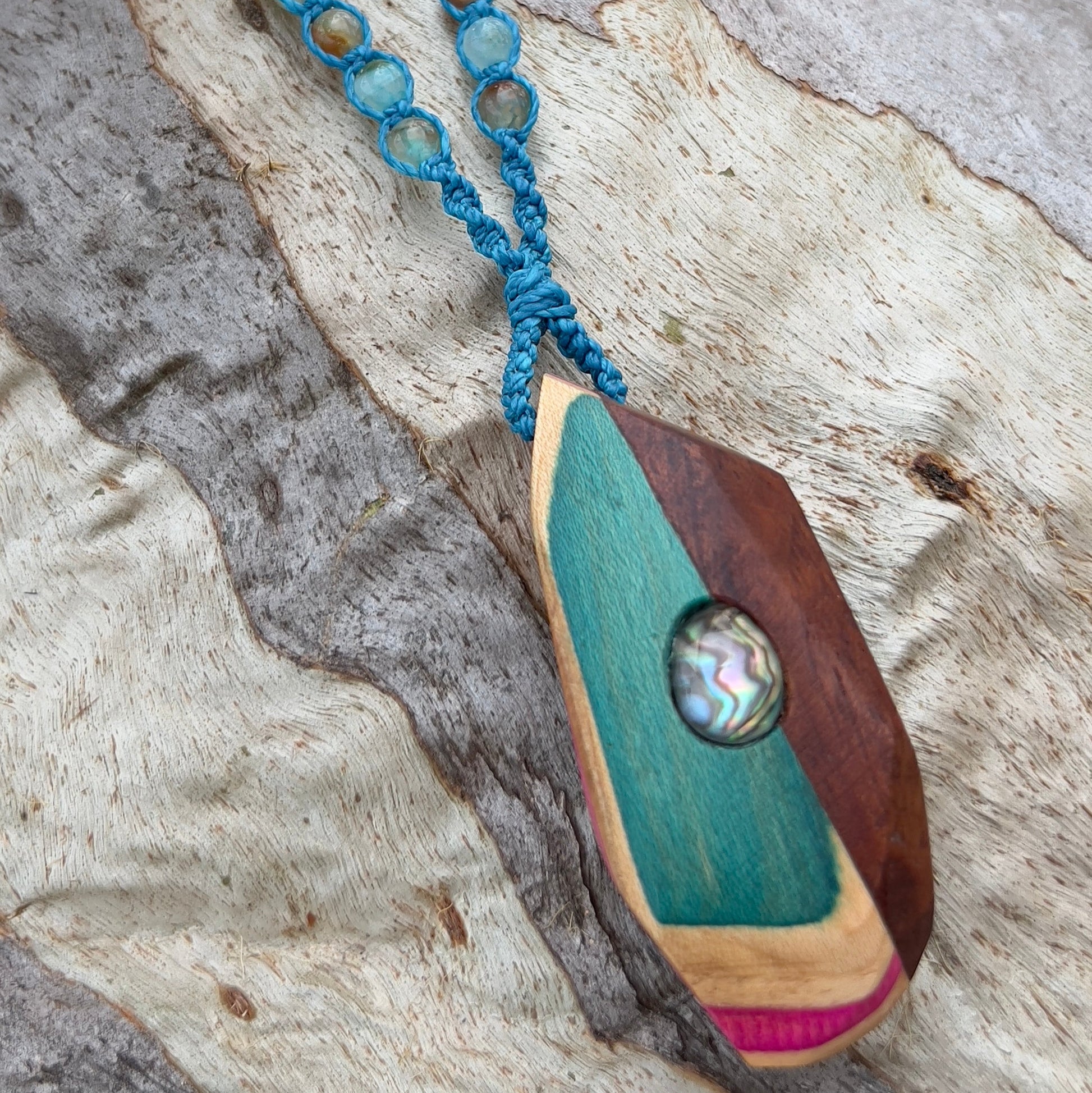 Handmade, unique recycled skateboard pendant with embedded Paua Shell & Quartz Doublet on an adjustable macrame necklace cord woven with Chalcedony beading