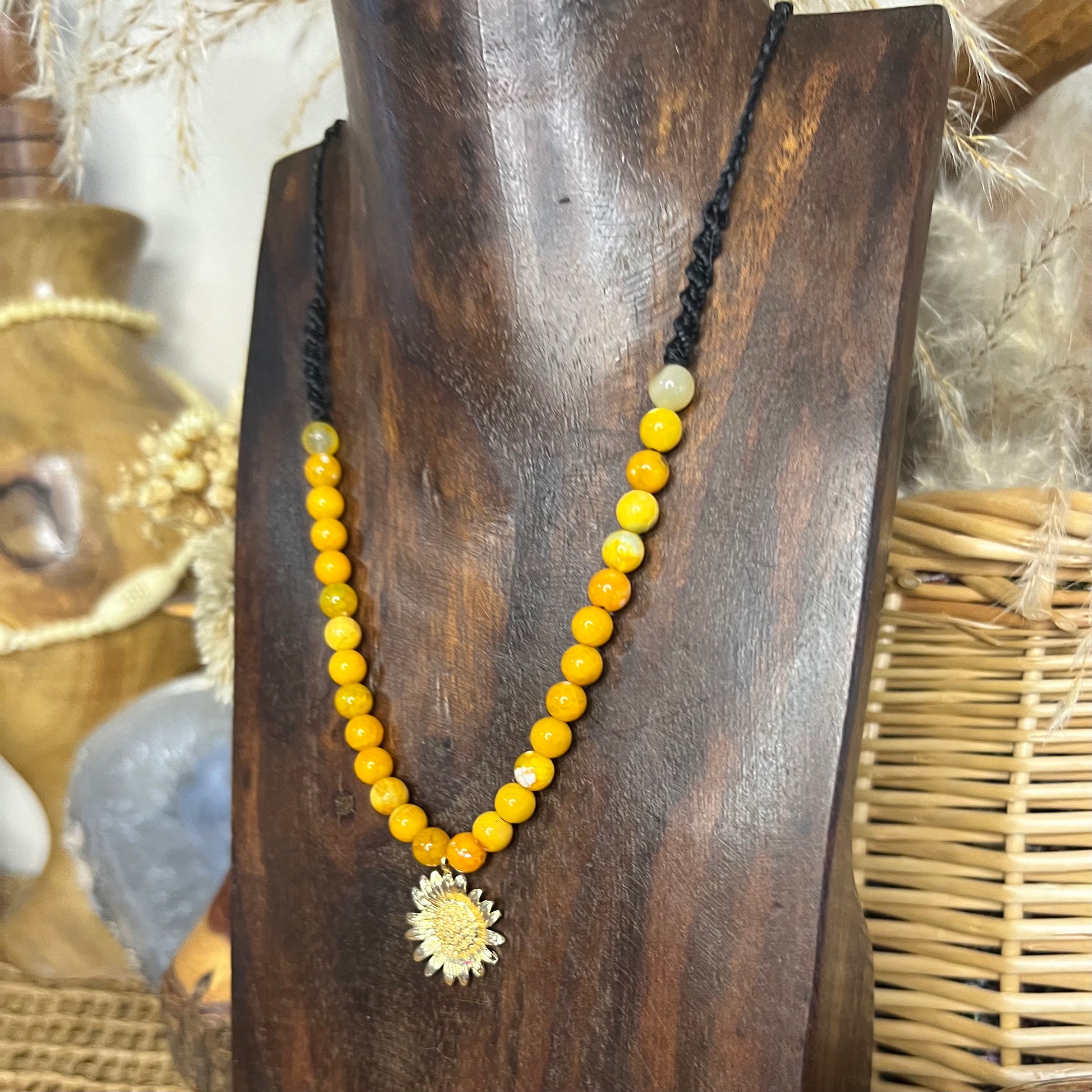 Handmade adjustable macrame necklace with Gold sunflower pendant and sunshine yellow dyed agate beading.