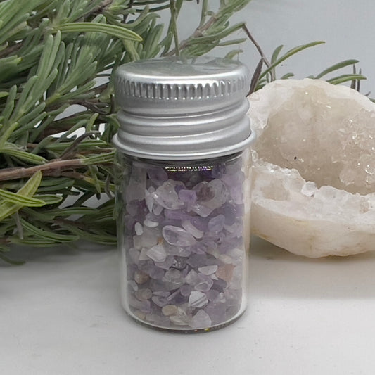 Small glass bottle of lavender toned semi-tumbled Amethyst Crystal Chips.