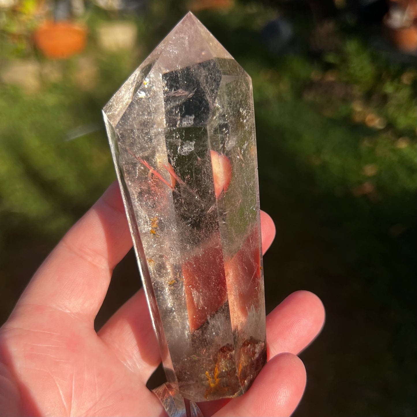 Stunning optical Hyaline Quartz Point with iron and hematite inclusions 