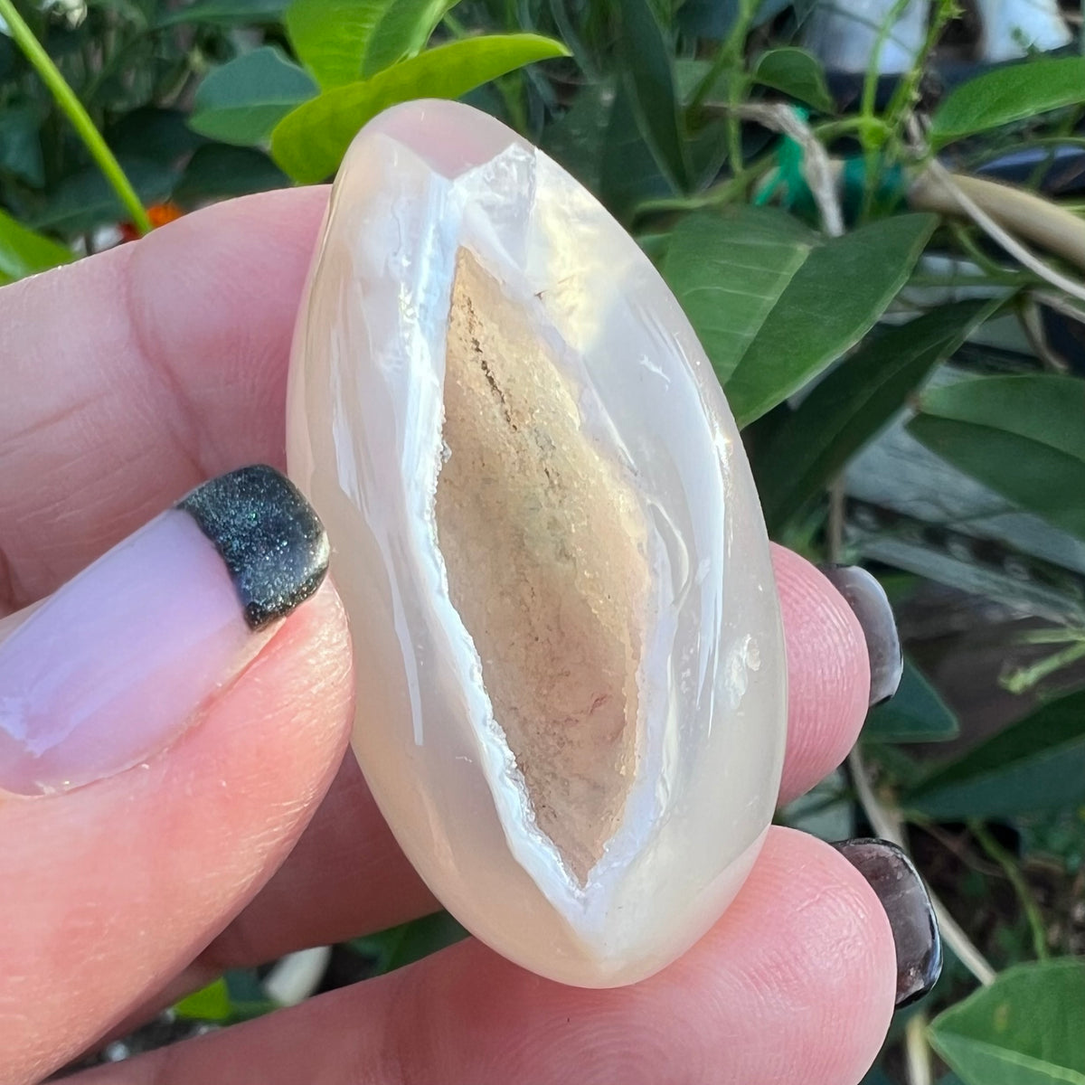 Beautiful sparkly druzy cave in a highly polished agate pocket meditation stone