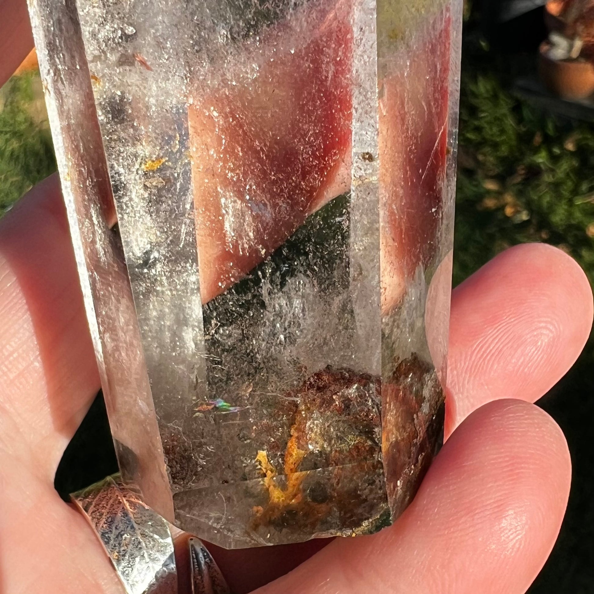 Garden inclusions with golden iron specks at the base of Hyaline Quartz point. 